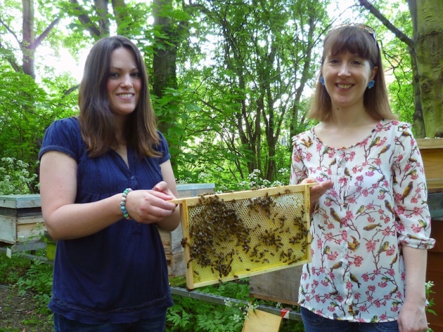 Emma and me holding a frame of bees