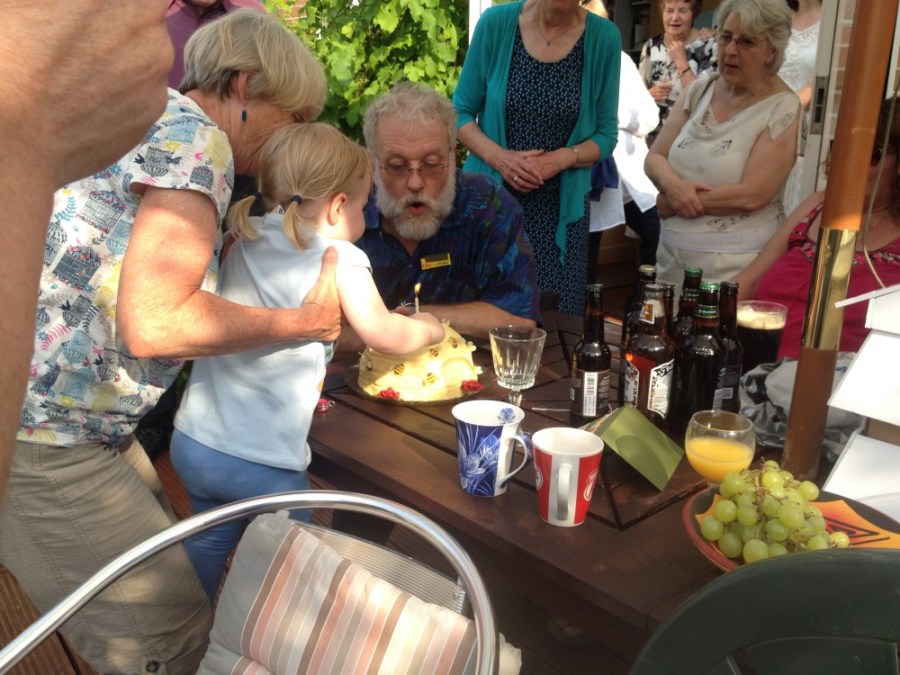 Andy Pedley and Scarlett blowing out his cake